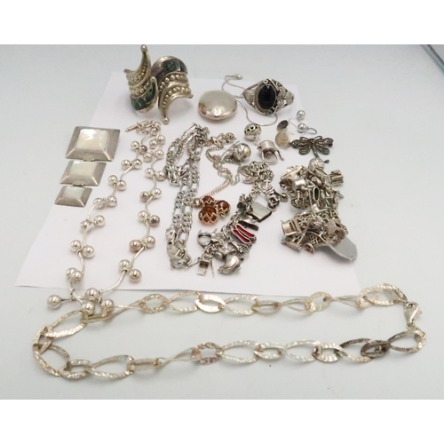 108 - A quantity of silver jewellery to include brooches, bangles and charm bracelets - approx weight 16 t... 