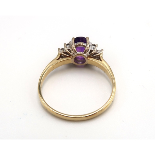 13 - An 18ct yellow gold amethyst and diamond ring, diamonds are well matched and bright and lively, head... 