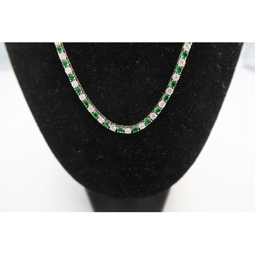 14 - A .925 silver simulated emerald and diamond necklace, approx 40cm long