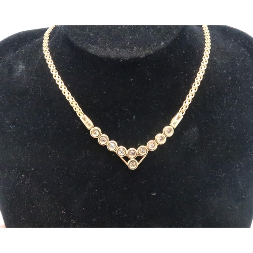 2 - A 14ct gold and diamond wishbone necklace, set with ten diamonds, each approximately 0.05ct, with fu... 