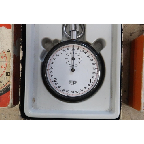 270 - A Heur stopwatch and a Smiths stopwatch, both working in saleroom and with boxes, together with two ... 