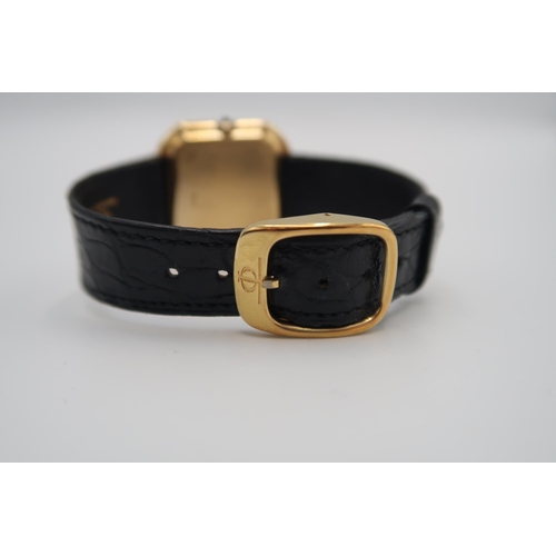 272 - A Baume & Mercier 18ct yellow gold wristwatch on black Baume & Mercier leather strap with sapphire s... 