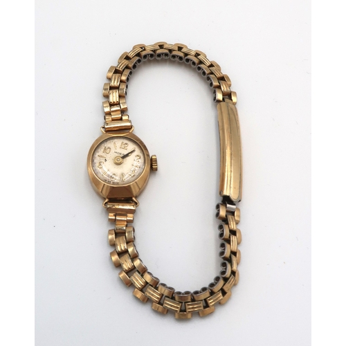 274 - A Moeris 9ct cased watch on a metal strap. Weight 12.88 grams