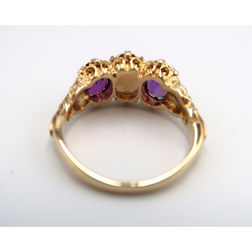 30 - A 9ct yellow gold opal and amethyst ring, head size approx 18mm x 10mm, size P/Q, amethysts are a go... 