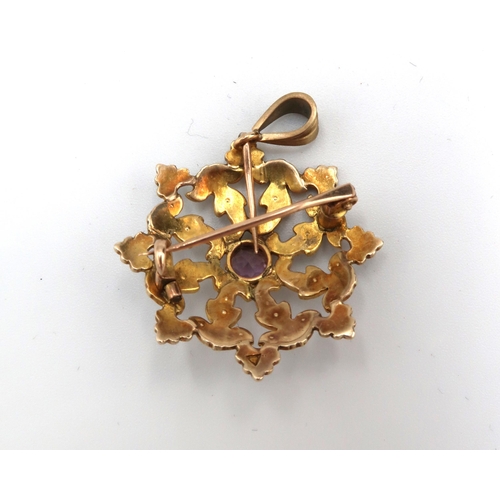 52 - A seed pearl and amethyst starburst brooch, unmarked but testing as at least 9ct gold, 5.5g total we... 