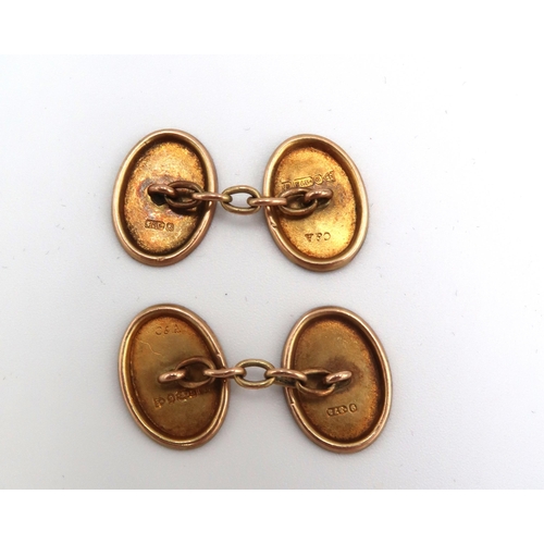 56 - A pair of 9ct gold chain link cufflinks, of oval form, foliate engraved, 3.5g total weight.