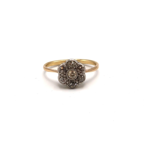 62 - A 9ct gold (tested) and diamond flower head cluster ring - unmarked but tested as at least 9ct - rin... 