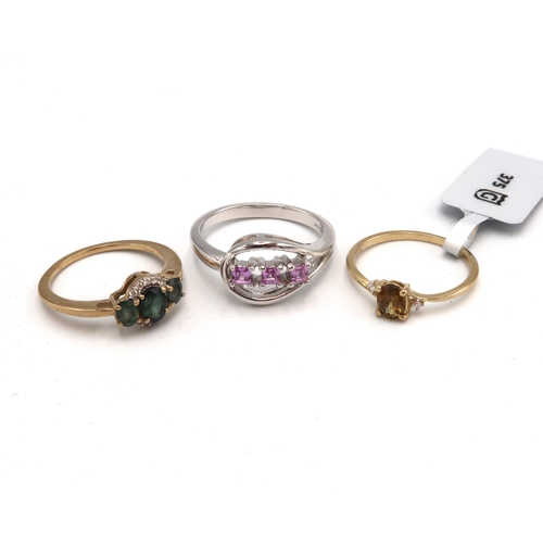 70 - Three 9ct gold rings to include sphene and diamond, size J 1/2, a purple sapphire three stone ring, ... 