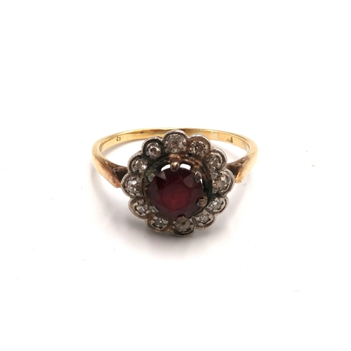 84 - A garnet cluster ring with old and single cut diamond surround. Size S 1/2. Tests gold 18ct. Weight ... 