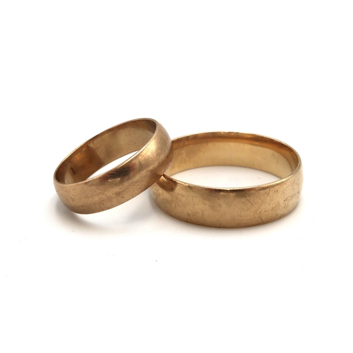 89 - Two 9ct gold band rings. The first 6.7mm, size Z+3. The second 5.8mm, size P 1/2. Weight 9.64 grams.