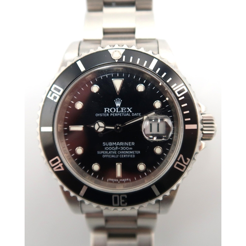 281 - A Rolex Oyster Perpetual 40mm Submariner 16610 serial number V392730 - with box and papers and garan... 