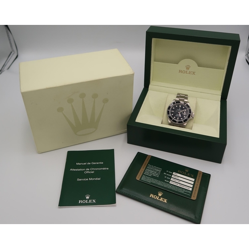 281 - A Rolex Oyster Perpetual 40mm Submariner 16610 serial number V392730 - with box and papers and garan... 