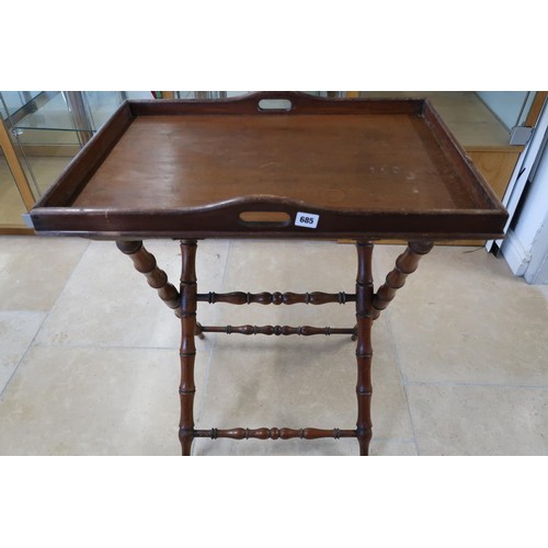 685 - A 19th century mahogany butlers tray and stand