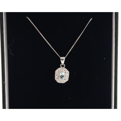 115 - A 9ct white gold Art Deco style aquamarine and diamond pendant on a 9ct white gold chain - head size... 