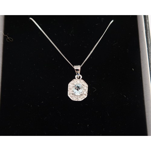 115 - A 9ct white gold Art Deco style aquamarine and diamond pendant on a 9ct white gold chain - head size... 