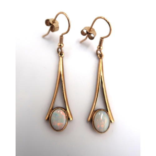 109 - A pair of 9ct gold and opal drop earrings, each of open trumpet form, the oval opals of approximatel... 