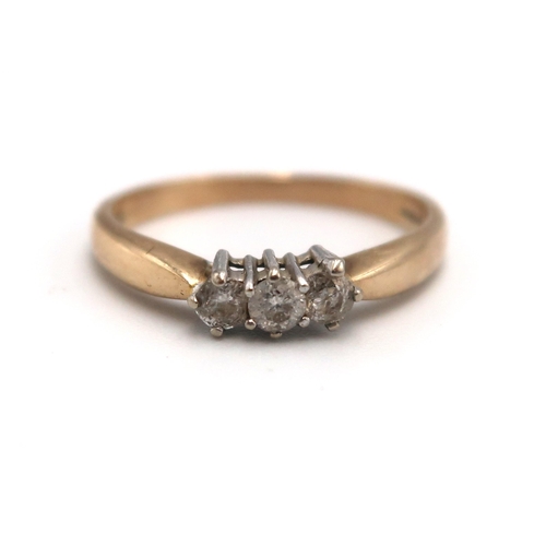 118 - A 9ct yellow gold three stone diamond ring size M 1/2 - approx weight 2.4 grams