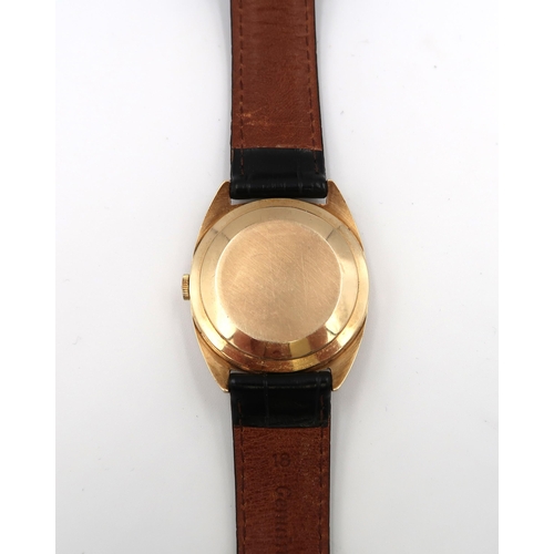 284 - A gent's Zenith 9ct gold automatic wristwatch having a baton numeral dial on champagne coloured face... 