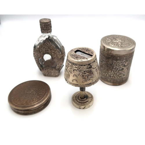 334 - A group of Cambodian white metal, likely low grade silver, comprising cylindrical box with lid, comp... 