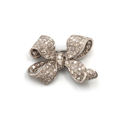 120 - A single cut diamond pave set bow brooch. Width 30mm. Estimated approximately 2cts total weight. Est... 