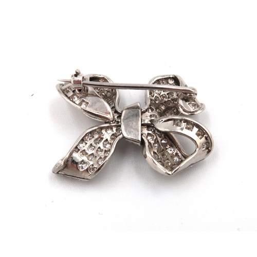 120 - A single cut diamond pave set bow brooch. Width 30mm. Estimated approximately 2cts total weight. Est... 