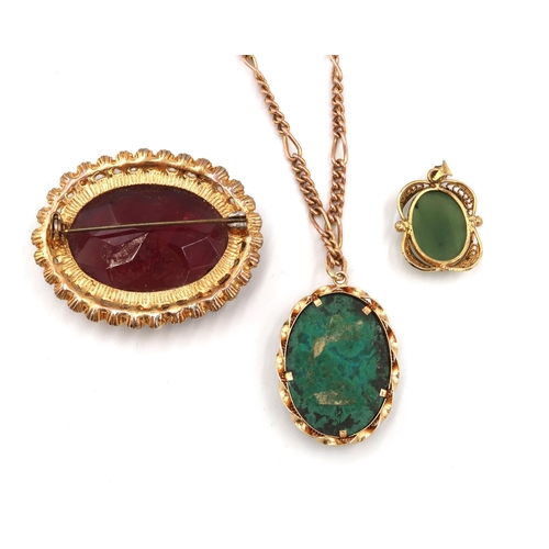 124 - An oval green stone pendant stamped 14K. Weight 10.73 grams. Suspended from a 9ct gold chain weight ... 