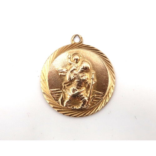 153 - A 9ct gold St Christopher pendant, of circular form, fully hallmarked verso, 4.4g.