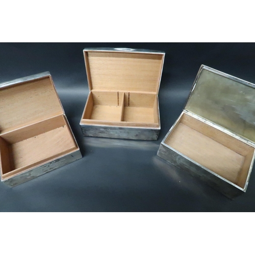 328 - Three hallmarked silver cigarette boxes, all with 'CDS' initials and engraved, largest box 14cm x 8c... 