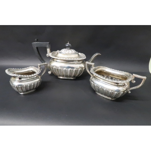 331 - A hallmarked silver teapot with matching jug and sugar bowl, total weight approx 21.5 troy oz