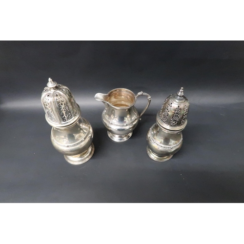 333 - A hallmarked matching set of silver jug and two silver shakers, tallest 19cm, total weight approx 18... 