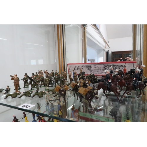 562 - A collection of WWI and WWII painted lead figures, playworn, together with mounted figures with an a... 