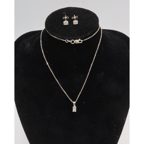 3 - A suite of 18ct white gold and diamond jewellery comprising a pendant necklace and earrings, each se... 