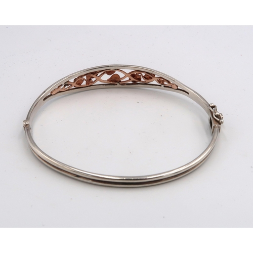  A Clogau bi colour silver bangle Weight 12.60 grams.