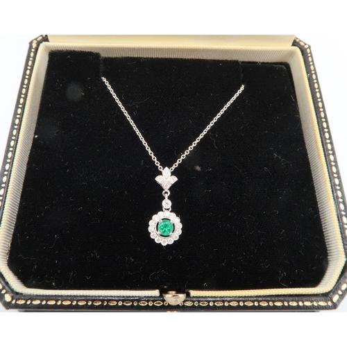  A quality 18ct White Gold Emerald and Diamond Drop Pendant on an 18ct White Gold Chain, The Diamonds... 