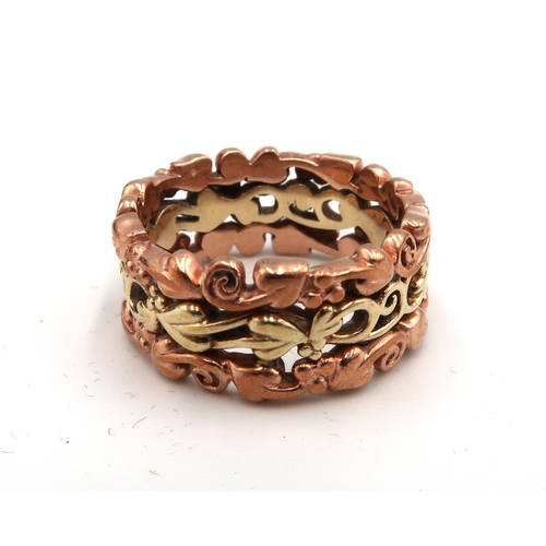  A 9ct rose and yellow gold Clougau openwork decorative band ring. Size O 1/2. Weight 7.62 grams