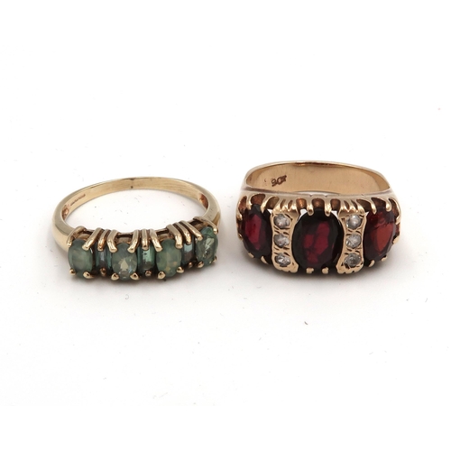 14 - Two dress rings to include garnet and white stone, size O 1/2 and a green stone half eternity size R... 