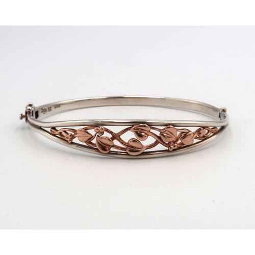 17 - A Clogau bi colour silver bangle Weight 12.60 grams.