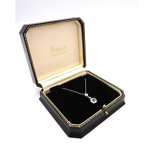 28 - A quality 18ct White Gold Emerald and Diamond Drop Pendant on an 18ct White Gold Chain, The Diamonds... 