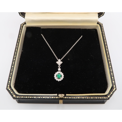 28 - A quality 18ct White Gold Emerald and Diamond Drop Pendant on an 18ct White Gold Chain, The Diamonds... 