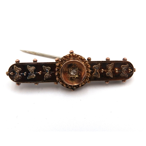 69 - A Victorian 9ct gold brooch set with a single diamond to the central roundle, with ivy engraved deco... 