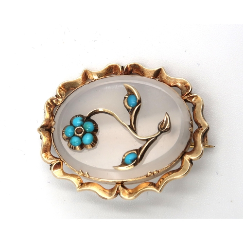 70 - A 9ct gold, agate and turquoise brooch, the oval cut agate inset with gold flower with turqoise peta... 