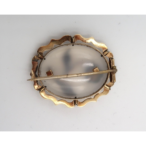 70 - A 9ct gold, agate and turquoise brooch, the oval cut agate inset with gold flower with turqoise peta... 