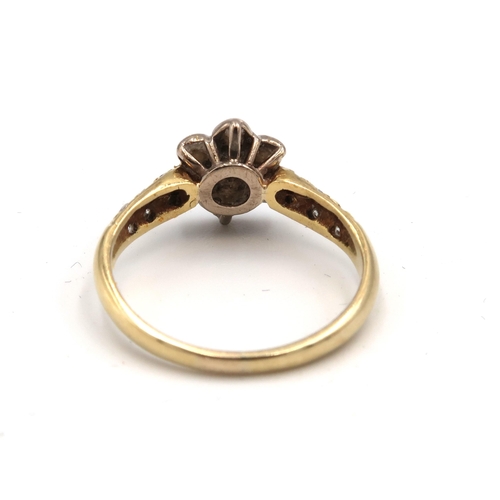 72 - An 18ct gold and diamond flowerhead ring, set with seven illusion set diamonds, each approximately 0... 