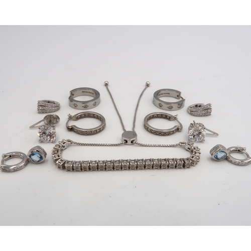 75 - A QVC silver and diamond set half tennis bracelet, with box chain and button adjusting clasp, fully ... 