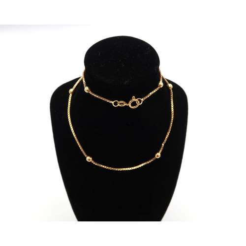 79 - An 18ct gold box link and ball neck chain, with 9ct gold clasp, 37cm long, 6.2g.