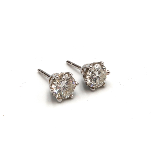 83 - A pair of diamond and 18ct white gold earrings - Estimated 1.36ct total diamond weight Estimated I/J... 