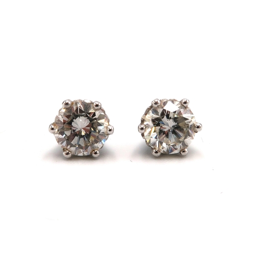 83 - A pair of diamond and 18ct white gold earrings - Estimated 1.36ct total diamond weight Estimated I/J... 