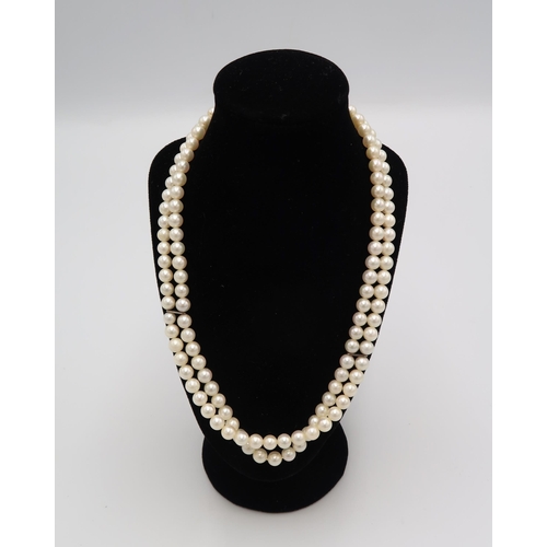 90 - A double row choker of pearls, with 18ct white told clasp set with three diamonds, and two restraini... 