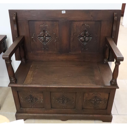 639 - A circa 1900s carved oak monks bench on a shaped plinth base, 107cm wide x 100cm high x 44cm deep