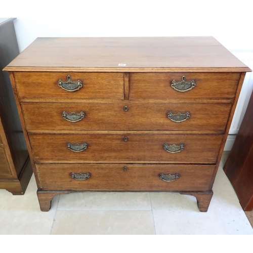 637 - A Georgian oak chest of two over three graduated drawers with later Victorian handles on bracket fee... 